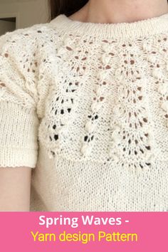 a woman wearing a white sweater with crocheted details on the shoulders and sleeves