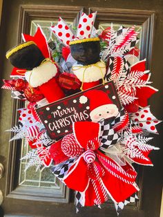 a christmas wreath hanging on the front door