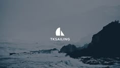 the logo for it's sailing is shown on top of an ocean rock formation