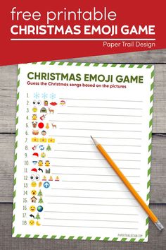 a christmas emoj game with a pencil next to it on a wooden surface and the text, free printable christmas emoi game paper