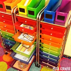 multicolored plastic bins stacked on top of each other in a classroom setting