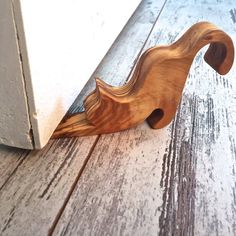 a wooden door handle on the side of a building