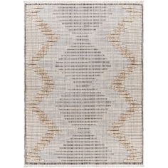 a rug with an abstract design in grey and beige colors on the floor, it is made