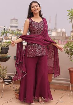 Readymade Faux Georgette Pakistani Suit in Wine. This attire with Cotton Lining is Enhanced with Resham and Sequins Work. Available with a Faux Georgette Palazzo and Faux Georgette Gota Lace Dupatta in Wine.The Kameez and Bottom Length are 32 and 40 Inches Respectively. We sell all kinds of salwar kameez sets for women Georgette Salwar Kameez | Crepe Salwar Kameez | Art Silk Salwar Kameez | Velvet Salwar Kameez | Chiffon Salwar Kameez | Net Salwar Kameez | Zari Work Salwar Suits | Indian Festiva Palazzo Salwar Suits, Elegant Sleeveless Chinon Sets, Long Suits Indian Party Wear, Fitted Sets With Mirror Work On Chinon, Fitted Chinon Sets With Mirror Work, Embroidered Fitted Georgette Pant Set, Fitted Embroidered Georgette Pant Set, Fitted Sequin Sets In Chinon, Fitted Embellished Sets In Chinon