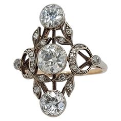 Stunning 18 kt Gold & Silver Ring With Diamonds from the 1900's ,Trilogy Diamonds: 25 diamonds ,3 Big Old Cut Diamonds 2° of Ca. 0.7 each and center Ca. 1 Ct. Material: 18 kt gold and silver Dimensions: Top of ring 20 mm x 24.6 mm Ring size: 57 Total weight: 3.6 gram / 0.125 oz / 2.3 dwt Antique Diamond Jewelry, Gold And Silver Ring, Designer Diamond Jewellery, Vintage Silver Rings, Gold And Silver Rings, Antique Diamond, Hand Jewelry, Three Stone Rings, Gold Diamond Rings