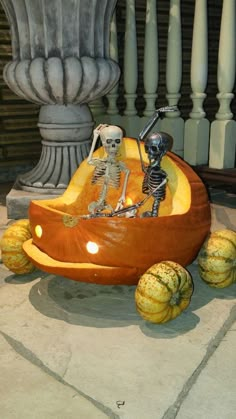 a fake skeleton in a pumpkin shaped car