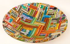 a multicolored bowl is shown on a white background