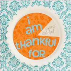 an orange and white paper plate with the words i am grateful for