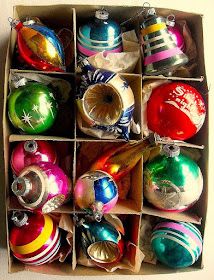 a box filled with lots of different colored ornaments