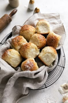 some bread rolls are on a black plate