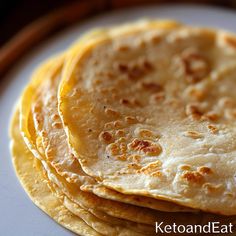 there are four flat breads on the plate