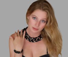 "This Chunky Black Chain Link Choker with its Swarovski rectangle crystals beads is a statement piece of jewelry. With its flat chain and large resin links, it is a bold and eye-catching accessory. Perfect for adding a touch of edginess to any outfit, this choker is sure to become a staple in your jewelry collection. The black color gives it a versatile and timeless appeal, while the chunky design adds a touch of modern style. Whether dressed up or down, this necklace is sure to make a big impac Bold Chunky Chain Jewelry For Party, Bold Chunky Chain Party Jewelry, Bold Chain Jewelry For Party, Bold Jewelry With Chain For Parties, Bold Party Jewelry With Chunky Chain, Bold Party Jewelry With Chain Detail, Black Chunky Link Chain Necklace, Bold Chain Link Jewelry For Party, Trendy Black Chain Link Jewelry