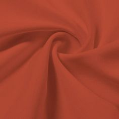 an orange fabric with very thin folds