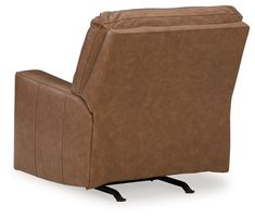 a brown recliner chair sitting on top of a white floor