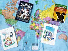 the world map is covered with posters and books