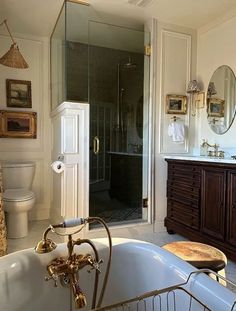 a bath room with a tub a sink and a mirror on the wall in it