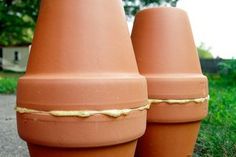 two large clay pots sitting next to each other