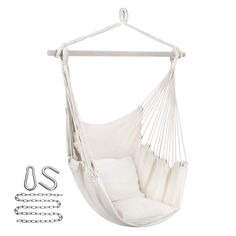 a white hammock chair hanging from a metal bar with chains attached to it