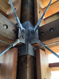 the inside of a wooden structure with metal brackets