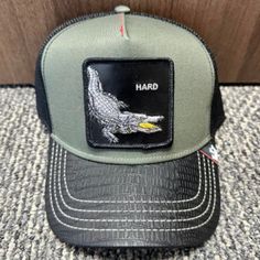 a hat with an alligator patch on it