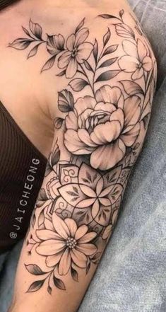 a woman's arm with flowers on it