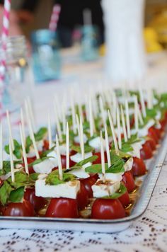 small appetizers are lined up on a table