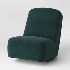 a green chair sitting on top of a white floor