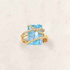 Ross-Simons - 9.25ct Sky Blue Topaz, .15ct t. w. Diamond Crisscross Ring Size 9. Dive into the bright blue hue of this breathtaking ring! Spotlighting a stunning 9.25 carat emerald-cut sky blue topaz with .15 ct. t. w. diamonds and 14kt yellow gold roping across the ample gem. 1/2" wide. Diamond and sky blue topaz ring. Blue Topaz birthstones are the perfect gift for December birthdays. Crisscross Ring, Yellow Topaz Ring, Blue Topaz Pendant Necklace, Sky Blue Topaz Ring, Topaz Birthstone, Colored Stone Rings, Blue Topaz Bracelet, Friend Jewelry, London Blue Topaz Ring