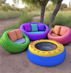 an inflatable couch and chairs are arranged around a fire pit on the ground