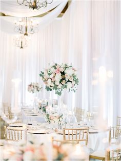 an elegant wedding reception with white and pink flowers