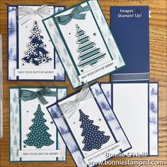 four cards with christmas trees on them, one is blue and the other is white