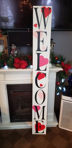 a welcome sign stands in front of a fireplace