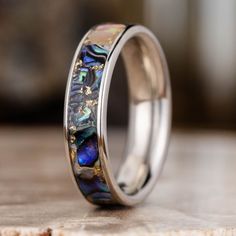 a wedding ring with an abanga shell inlay