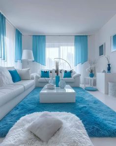 a living room filled with white furniture and blue curtains