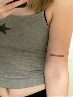 a woman with a star tattoo on her arm