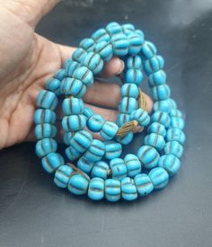 Antique Old Naga Hill Tribe Turquoise Blue Tone GLASS Ethnic bead Necklace strand For Create Jewelry collectible Great condition! Bead size : 6mm Length : 22 inches Blue Wooden Beads For Festival, Blue Wooden Beaded Bracelets For Beach, Artisan Blue Jewelry For The Beach, Artisan Blue Jewelry For Beach, Traditional Turquoise Wooden Beads, Southwestern Style Large Beads For Beach, Artisan Blue Wooden Beads, Southwestern Style Large Beads, Southwestern Style Large Beach Beads