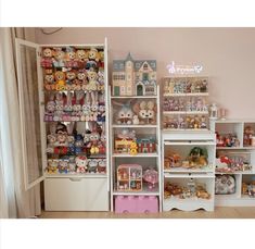 a room filled with lots of different types of stuffed animals on shelves next to each other