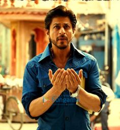 a man standing with his hands folded in prayer