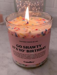 a candle that is sitting on a table with confetti around it and the words go shawty it's yo'yo'o'birthday