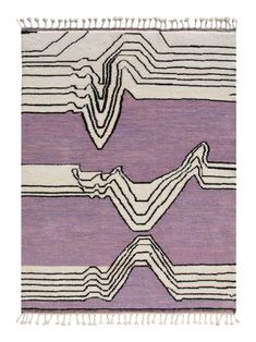 a purple and white rug with fringes on the bottom, in two different colors