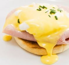 a sandwich with ham, cheese and hollandaise sauce