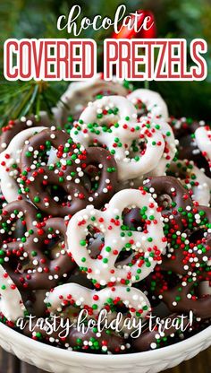 chocolate covered pretzels in a white bowl with sprinkles on top