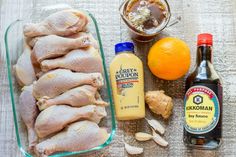 chicken, oranges and other ingredients on a table