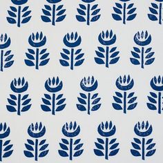 a blue and white wallpaper with leaves on it