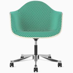 an office chair with green and white checkered upholstered fabric on the back