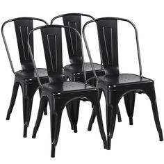 four black metal chairs sitting side by side