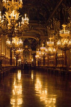 an ornate room with chandeliers and lights