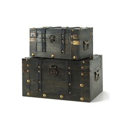 two trunks stacked on top of each other, one with brass hardware and the other without