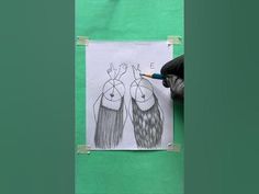 a drawing of two people with long hair and one has a pencil in his hand