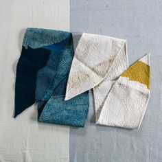 four pieces of cloth laid out on top of each other